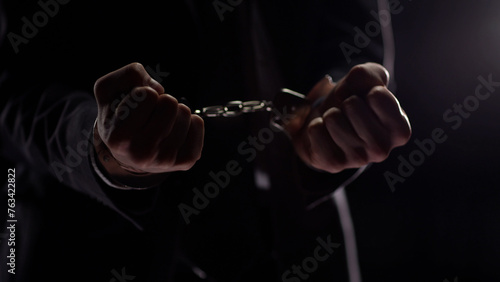 Businessman in handcuffs concept of illegal business © Katsiaryna