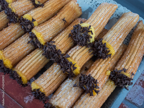 Churros con chocolate y crema pastelera photo