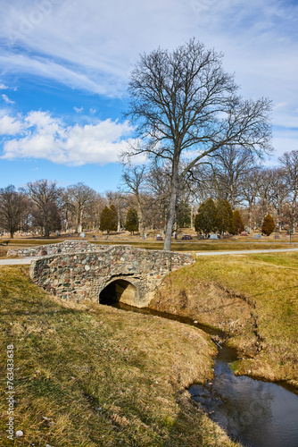 Tranquil Park with Stone Bridge and Stream, Lindenwood Cemetery photo