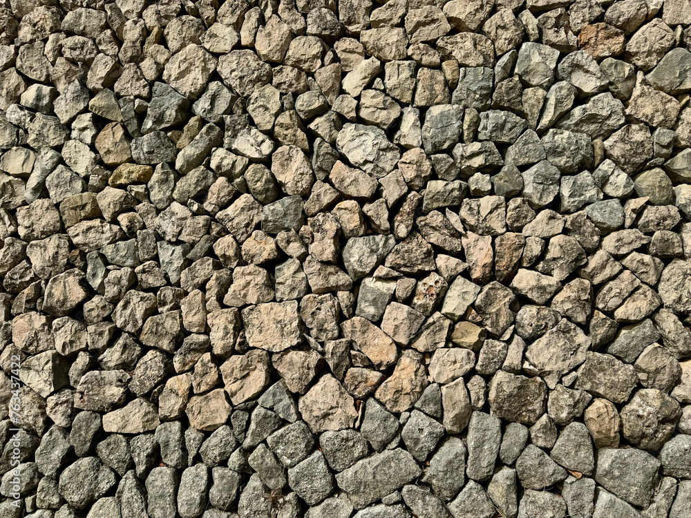 Texture of a rock wall built with the ancient dry stone technique. All stones are fitted together without concrete. Texture of a rock wall built with the ancient dry stone technique. All stones are fitted together without concrete.