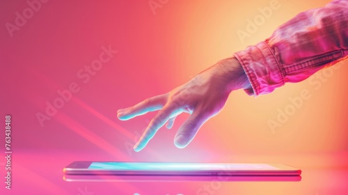 A persons hand reaching towards a laptop computer on a desk, indicating technology and productivity in a professional setting