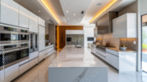 A deliberately blurred image showcasing a spacious  modern kitchen interior  ideal for background use or design mockups. Resplendent.
