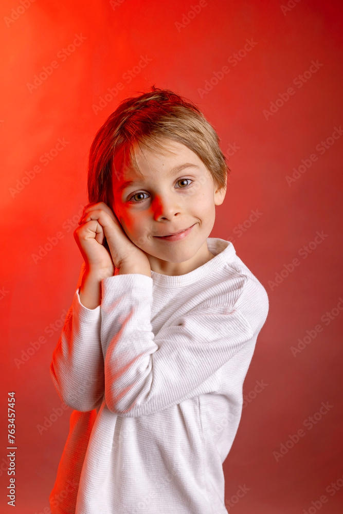 Artistic portrait of a child, boy, lightened with gel filters, studio shot Artistic portrait of a child, boy, lightened with gel filters, studio shot