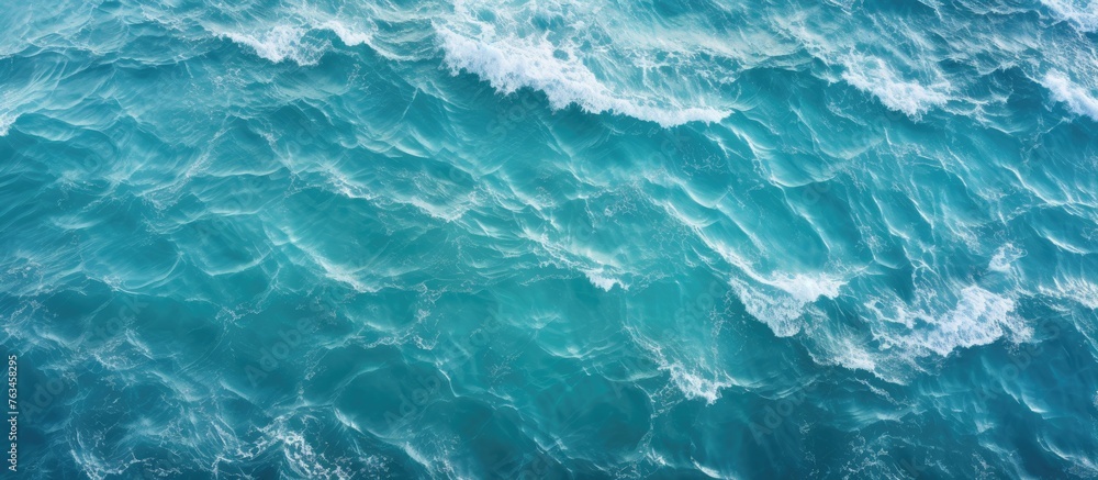Blue ocean waves closeup aerial view turquoise water surface texture