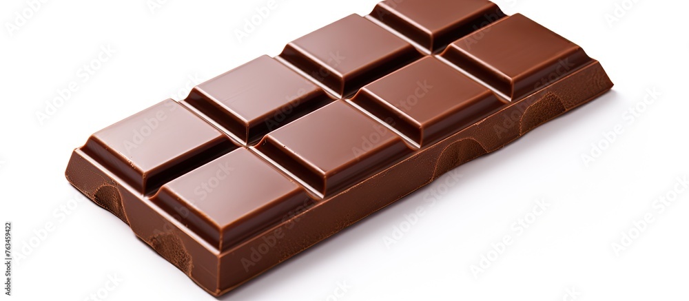 A chocolate bar on a white surface A chocolate bar on a white surface