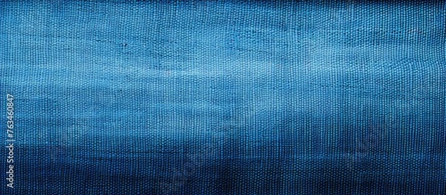 Dark blue canvas texture with thread close up macro textile surface