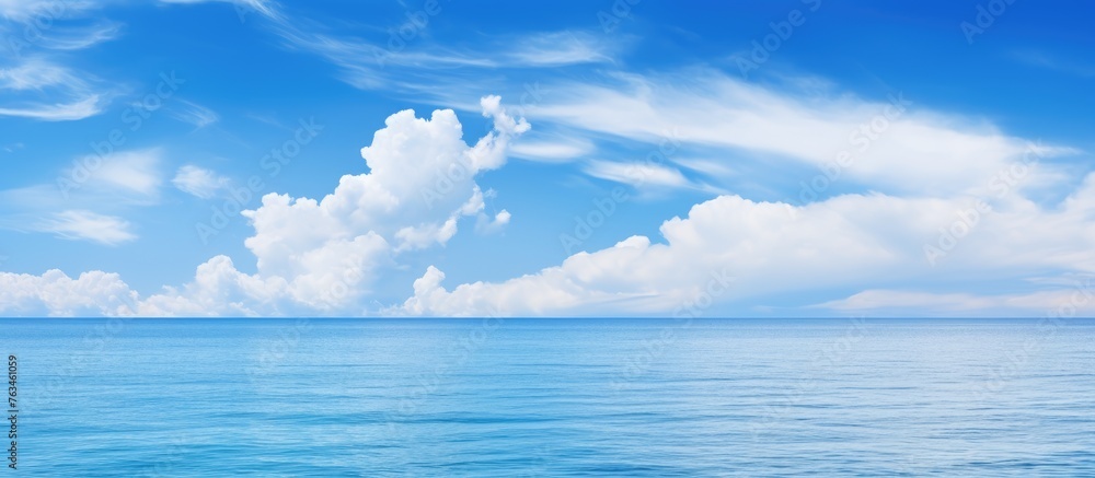 Calm ocean with cloud in sky