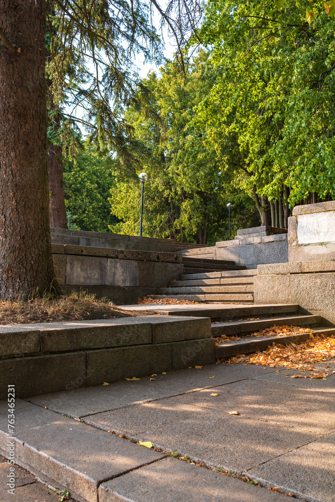 Granite steps in the rays of the autumn sun. Beautiful sunny landscape.