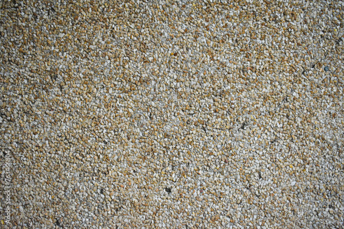 Yellow / brown little stone wall background texture