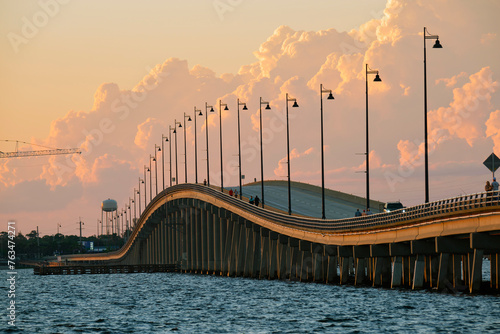 Barron Collier Bridge and Gilchrist Bridge in Florida with moving traffic. Transportation infrastructure in Charlotte County connecting Punta Gorda and Port Charlotte over Peace River