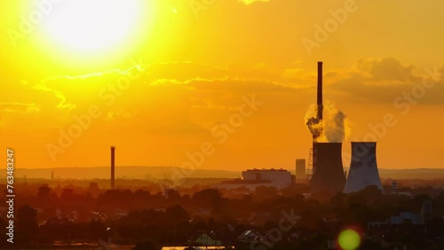 Smoke coming out of the chimneys of a thermal power plant on a very warm, sunny day. Krakow, Poland.