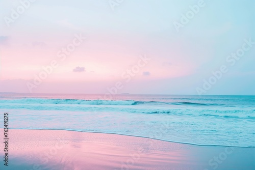 Calm waves and soft pink hues paint a tranquil tropical beach scene at twilight