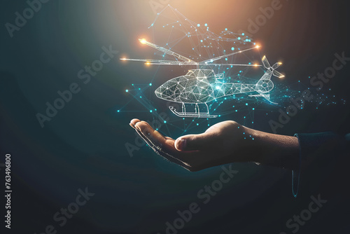 Man's hand holding virtual helicopter icon , Technology business delivery e-commerce,  program,  logistic, software, app, delivery, AI, Online, Mobile, air, application, dark background, lights photo