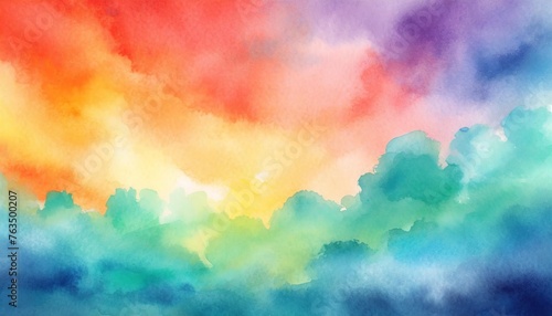 colorful watercolor background of abstract sunset sky with puffy clouds in bright rainbow colors of red orange green blue yellow and purple