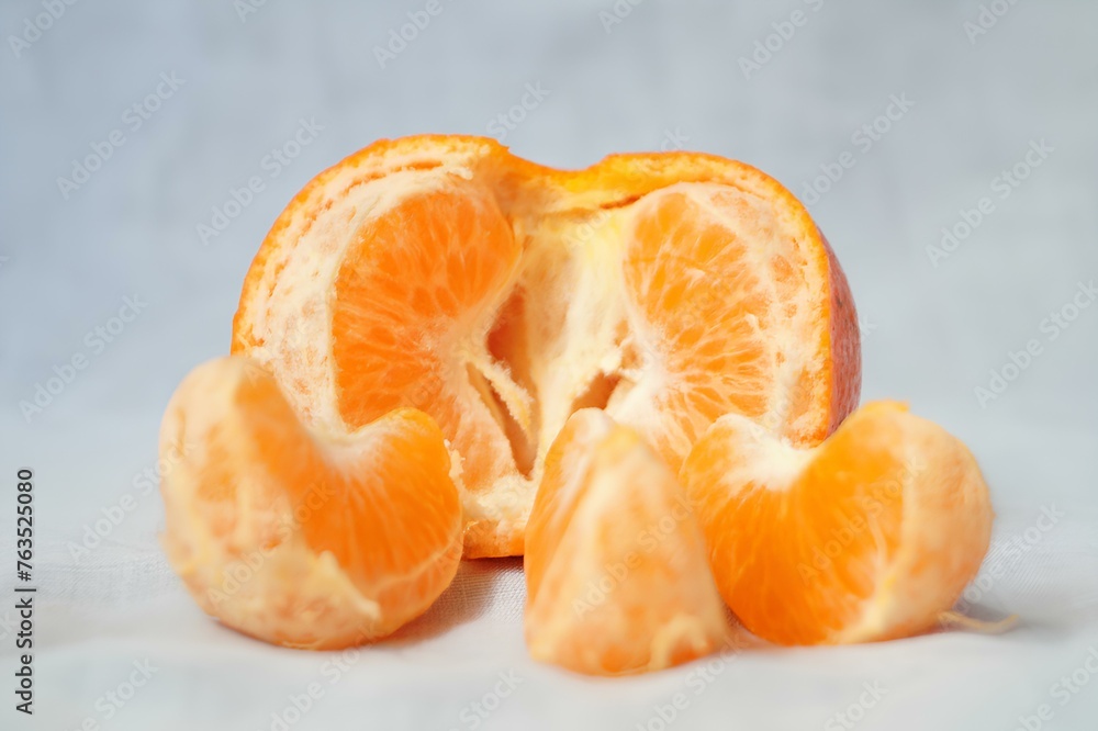 A peeled orange with the inside exposed A peeled orange with the inside exposed