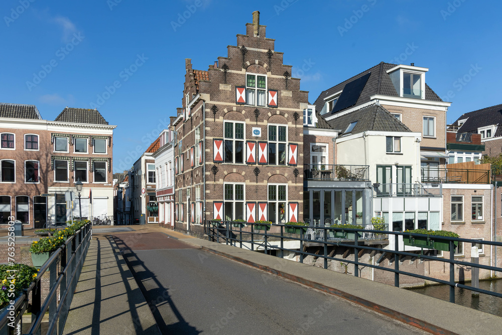 Gorinchem, the Netherlands. 27 February 2024. Typical houses with red and white shutters on the window in the fortified city Gorinchem along the bridge and canal Linge.