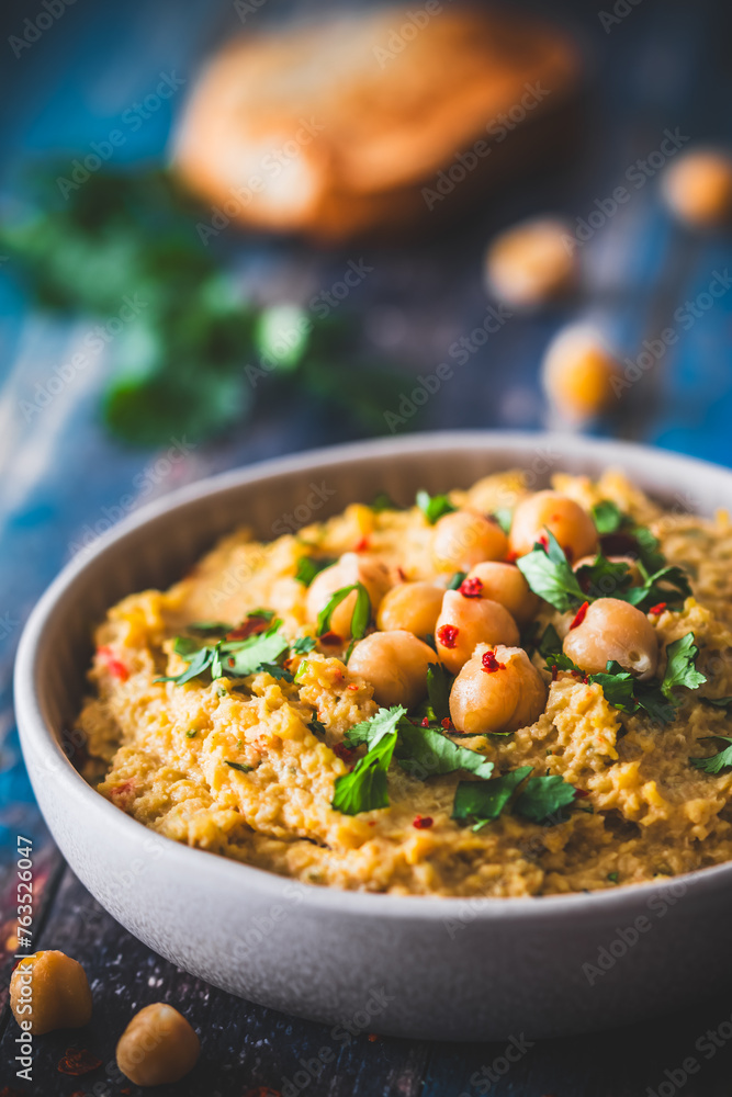 Hummus, chickpea puree with coriander in a bowl