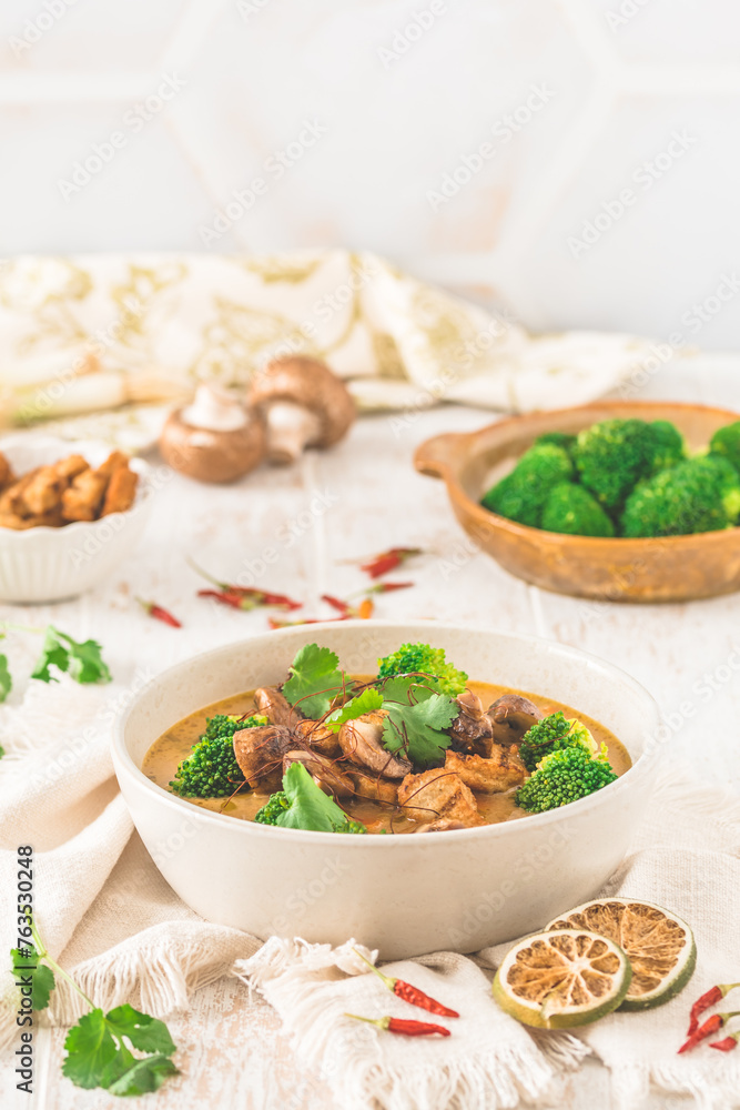 Tom Kha Gai soup with various vegetables and roasted chicken or soy-based meat substitutes Tom Kha Gai soup with various vegetables and roasted chicken or soy-based meat substitutes