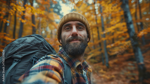 Man taking selfie in autumn forest