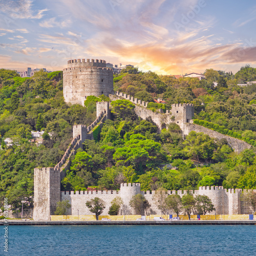 View of Rumelihisari, Bogazkesen Castle, or Rumelian Castle, from Bosphorus strait after dawn, located at the hills of the European side of Bosphorus Strait, Istanbul, Turkey photo