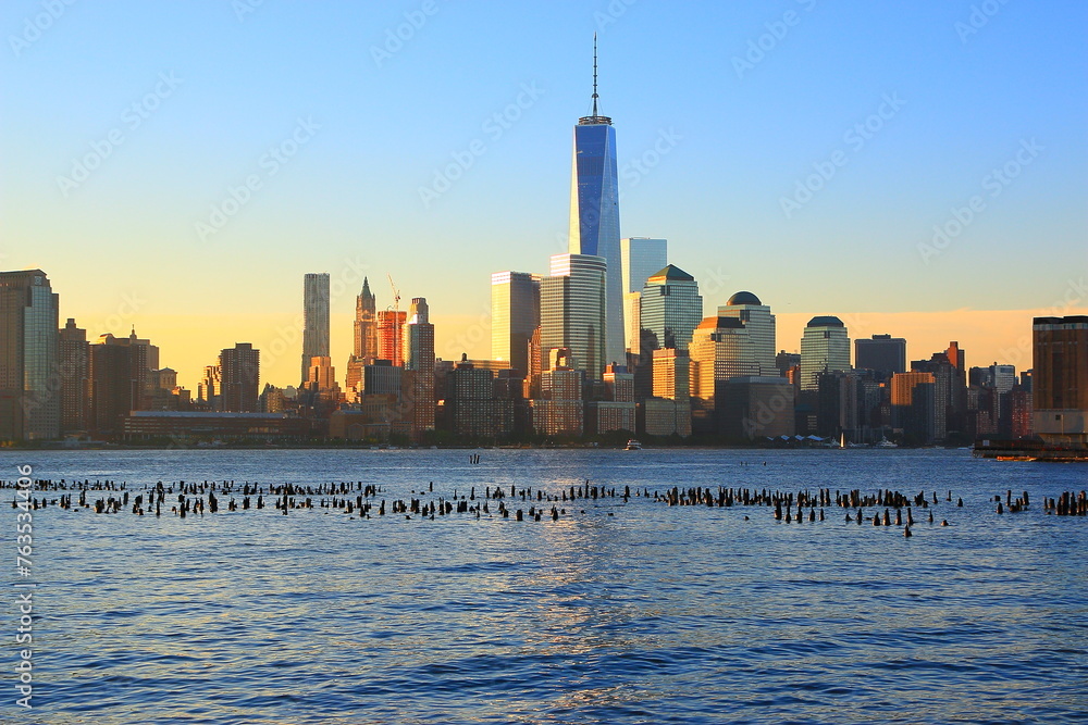 View of Lower Manhattan skyline at sunset time.