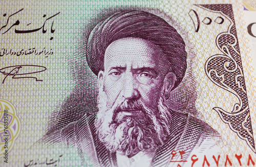 Portrait of iranian cleric and revolution supporter Hassan Modarres on 100 Iran Rial currency banknote  (focus on center) photo
