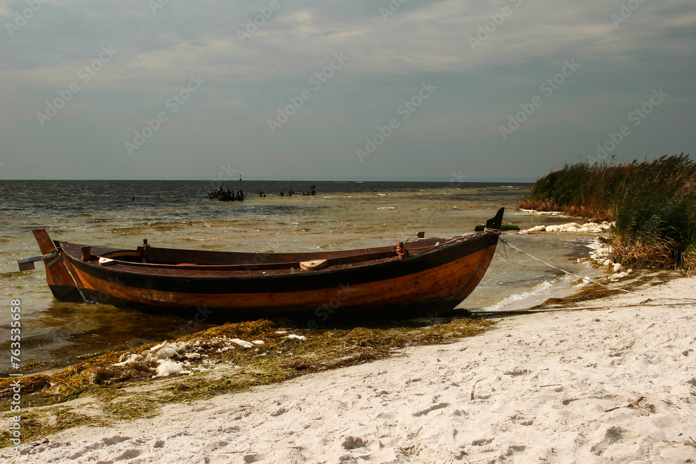 Wooden classic boat on the lake shore