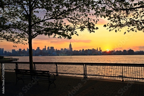 View of Lower Manhattan skyline at sunset time.