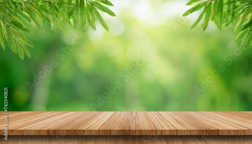 empty wooden table or shelf over green blurred nature background summer background with empty space for product display
