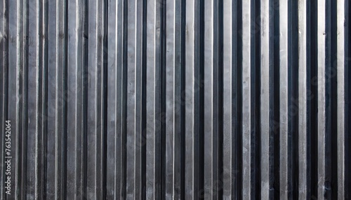 panorama of black corrugated metal background and texture surface or galvanize steel