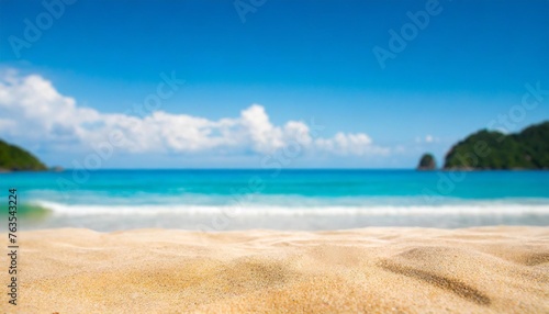 summer sandy beach with blur ocean on background