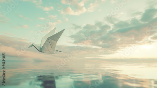 Origames de papel voando sobre o mar  photo