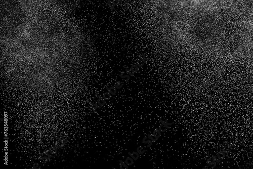 Abstract splashes of water on black background. White explosion. Light clouds overlay texture. 