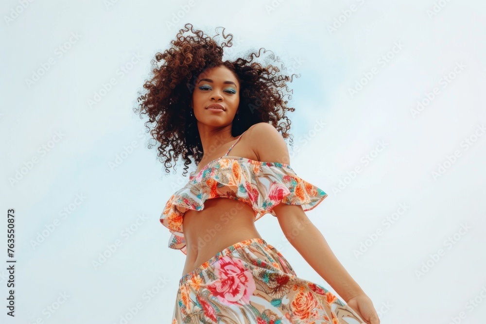 Beautiful African American woman with curly hair in a summer dress ...