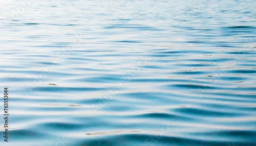 white water with ripples on the surface defocus blurred white colored calm calm water surface texture with splashes and bubbles shiny pattern texture background with water waves