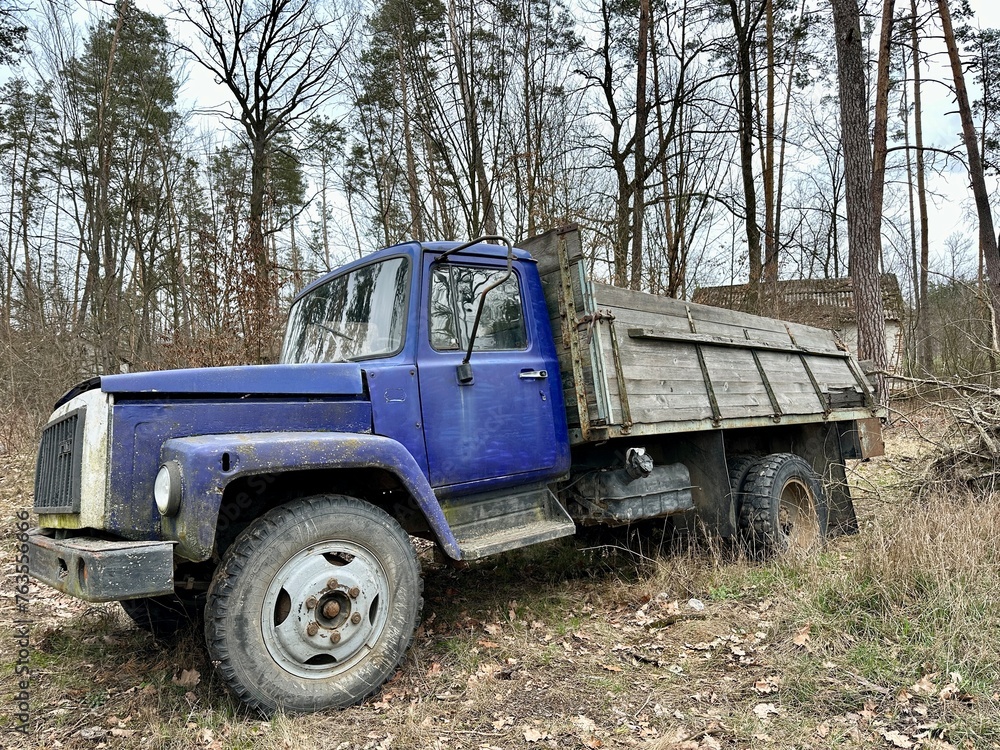 Truck against a background of trees. Old truck in the forest. Broken truck in the open air. Truck against a background of trees. Old truck in the forest. Broken truck in the open air.