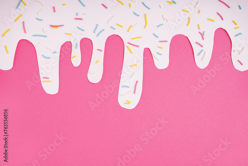 Paper glaze with colorful sweet sprinkles on pink background