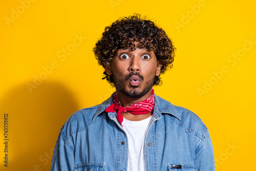 Photo portrait of nice young male shocked face pouted lips wear trendy denim outfit red scarf isolated on yellow color background