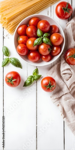 Tomatoes and spaghetti on white wooden table, pasta ingredients