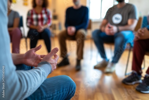 A group of people sitting in a circle talking to each other during a therapy session at a support club for mental health Generative AI photo