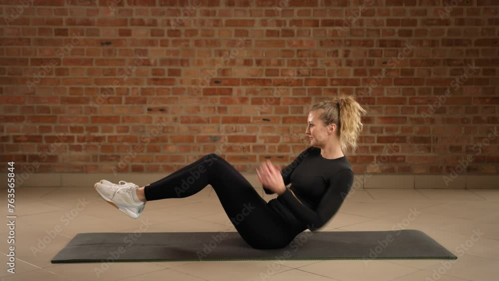 Exercise Rotation Russian A fitness expert performs the Russian twist, an effective exercise for ...