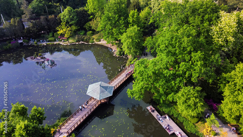 Drone view on Japanese garden in Wroclaw with walking people (blurreв motion)