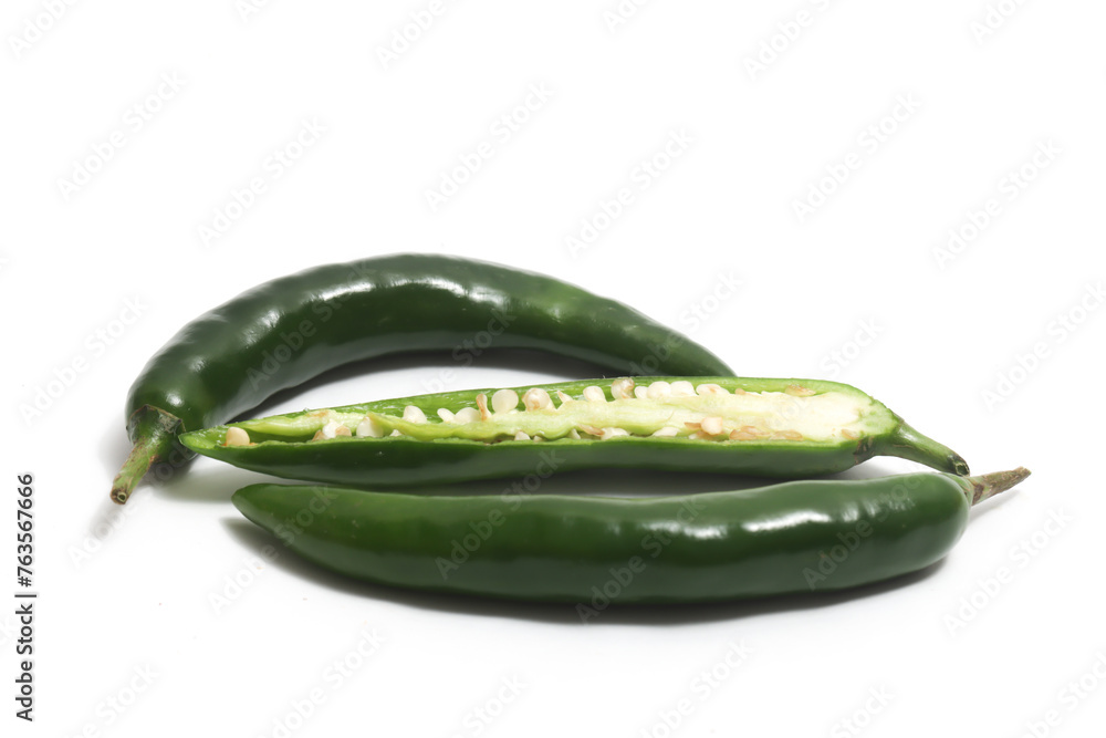 Half sliced green hot chili pepper isolated on white background clipping path Half sliced green hot chili pepper isolated on white background clipping path