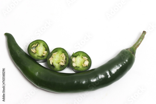 Tthree sliced green hot chili pepper top view isolated on white background clipping path photo