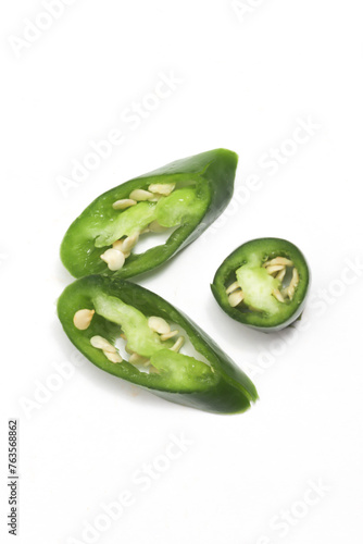 Three sliced green hot chili pepper top view leaf photo concept isolated on white background clipping path