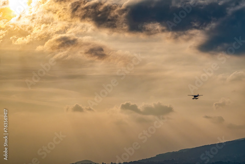 Seaplane flying at sunset hours