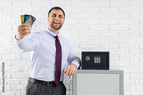 Happy businessman holding c...