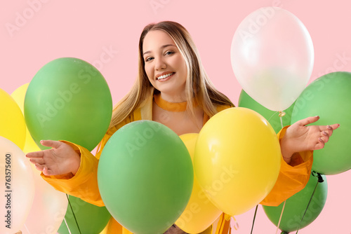 Young woman in raincoat wit...