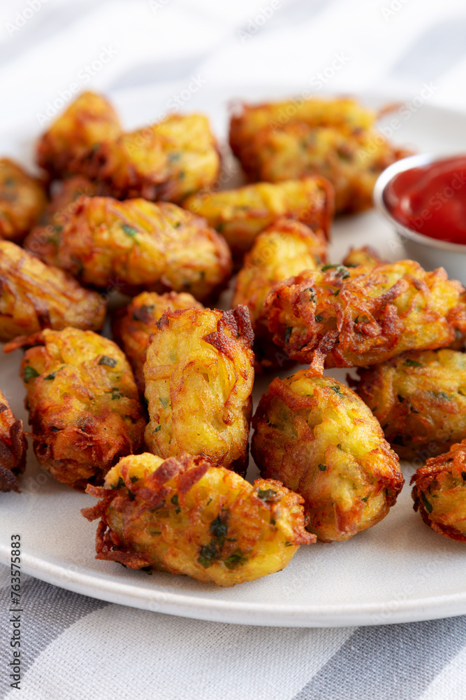 Homemade Fried Tater Tots on a Plate, side view. Homemade Fried Tater Tots on a Plate, side view.
