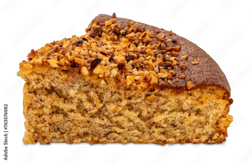 Hazelnut sponge cake, view of slice with roasted hazelnut kernels on top, isolated Hazelnut sponge cake, view of slice with roasted hazelnut kernels on top, isolated